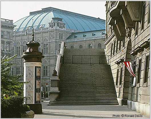 Entrance to the Albertina (right), Vienna. Column with posters announcing the museum's exhibitions "Raphael in der Albertina," and "Stanley Roseman - Zeichnungen aus Klostern," 1983. Photo � Ronald Davis